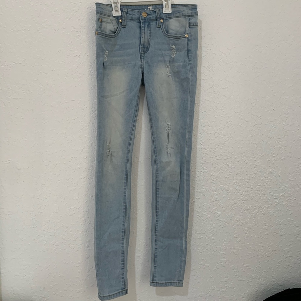 Slightly ripped girls skinny jeans